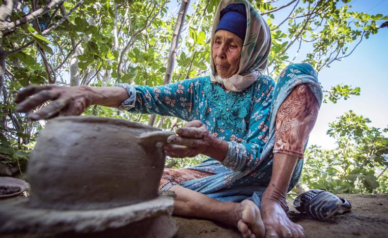 Moroccan potter Fatima Harama from the M'tioua tribe works on pottery near the village of Ourtzagh