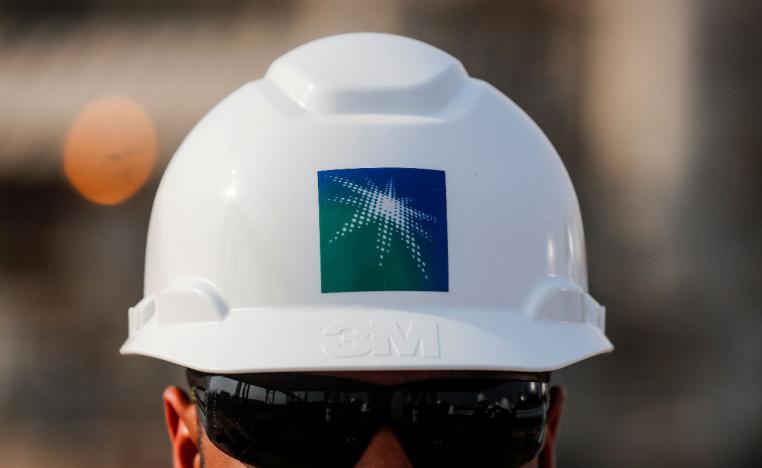 An employee in a branded helmet is pictured at Saudi Aramco oil facility in Abqaiq