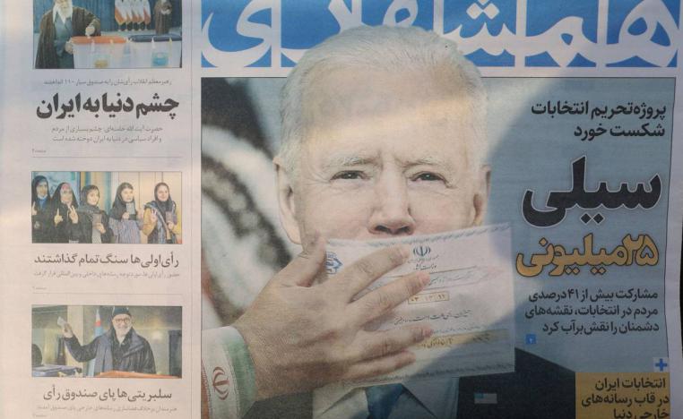 الصفحة الأولى في جريدة إيرانية تحمل صورة بايدن مكمما