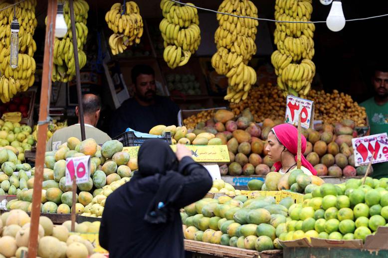 A woman shops at a market in Cairo