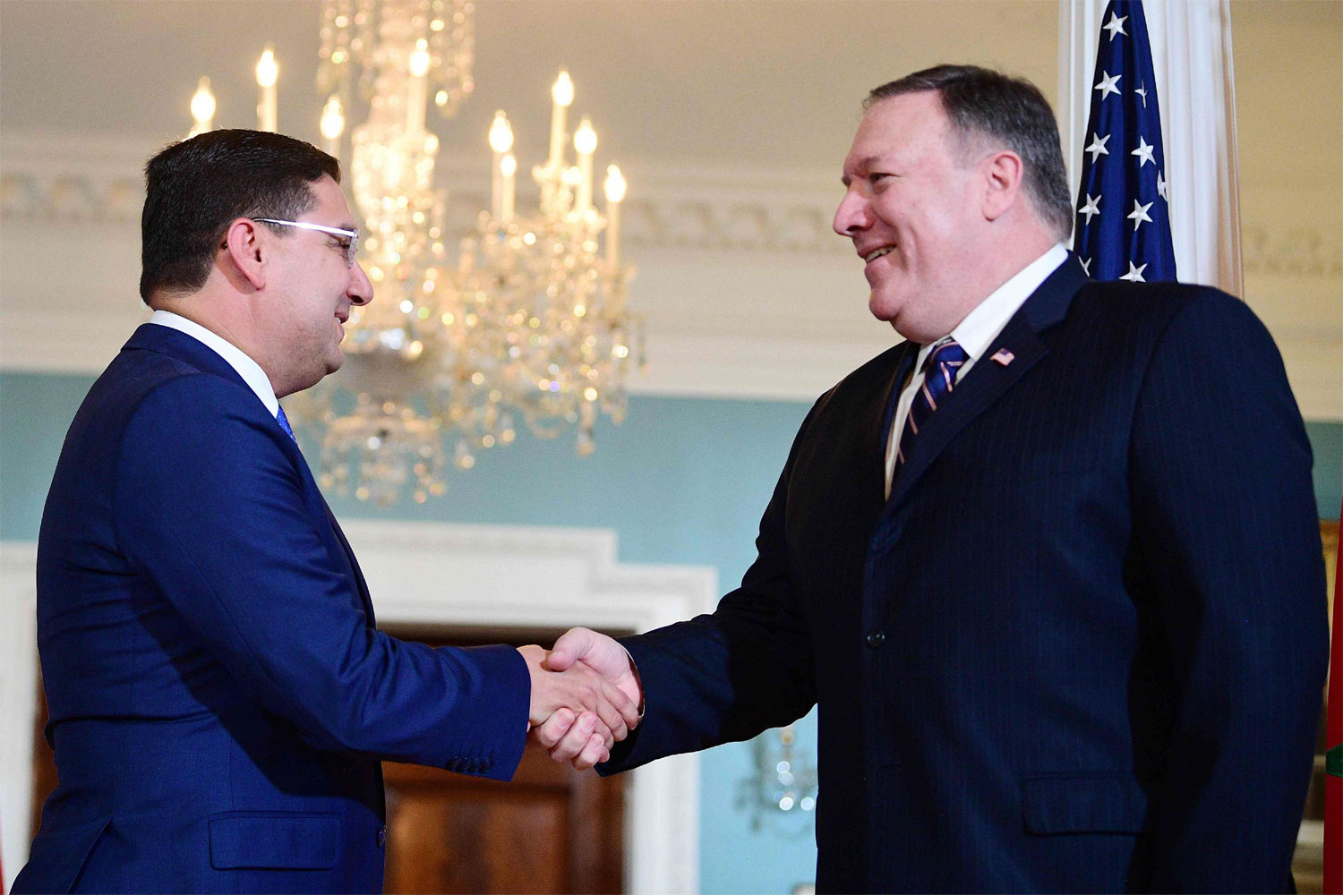 Moroccan Foreign Minister Nasser Bourita (L) shakes hands with US Secretary of State Mike Pompeo at the US State Department in Washington
