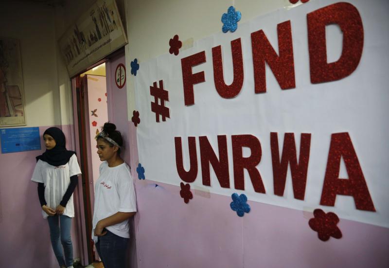 Palestinian refugee students stand outside a classroom at one of the UNRWA schools in Beirut, Lebanon, on September 3