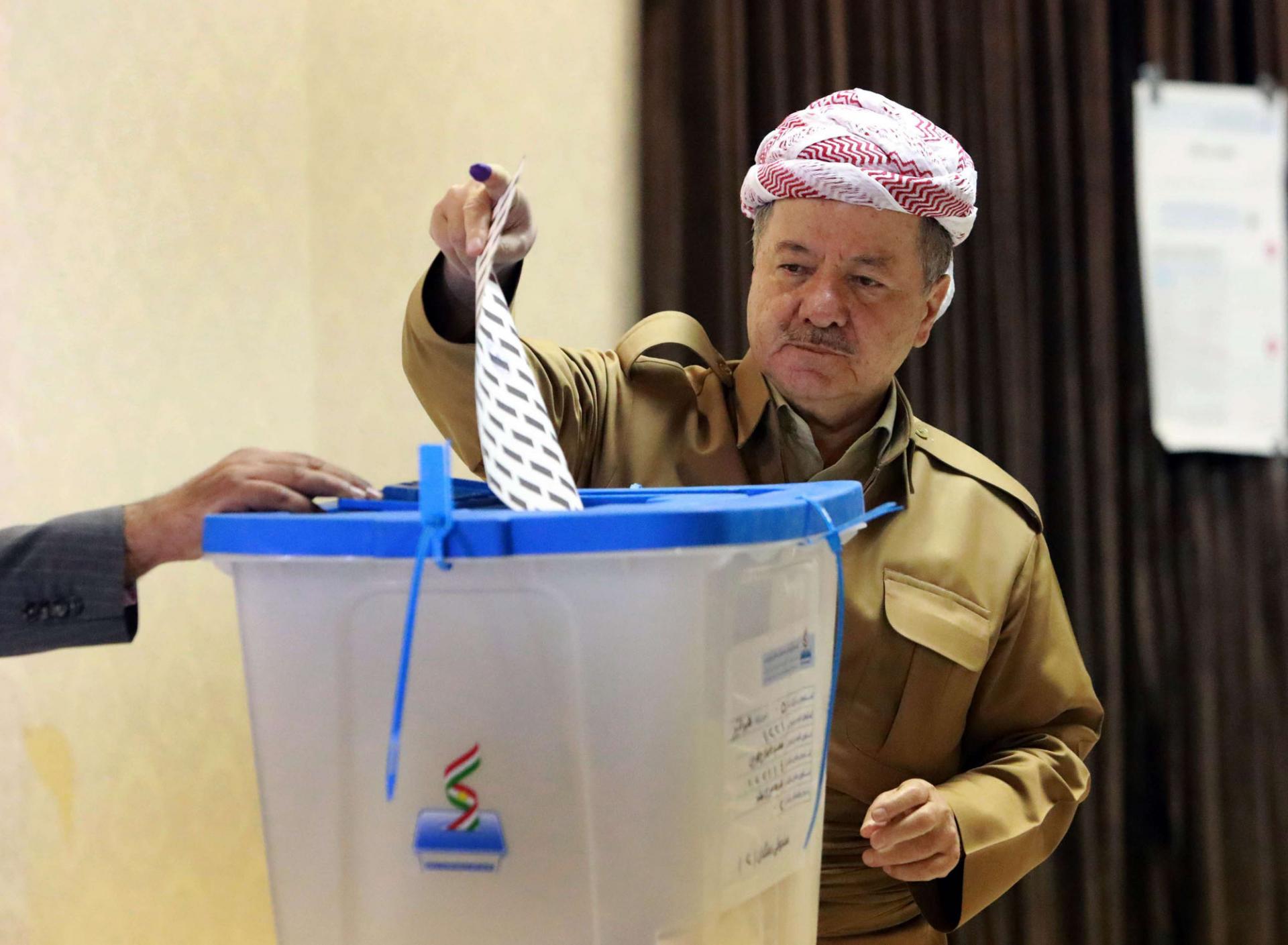  Former leader of the Iraqi Kurdish Regional Government (IKRG) Masoud Barzani gestures after casting his ballot for the parliamentary election at a polling station in Arbil, the capital of the Kurdish autonomous region in northern Iraq