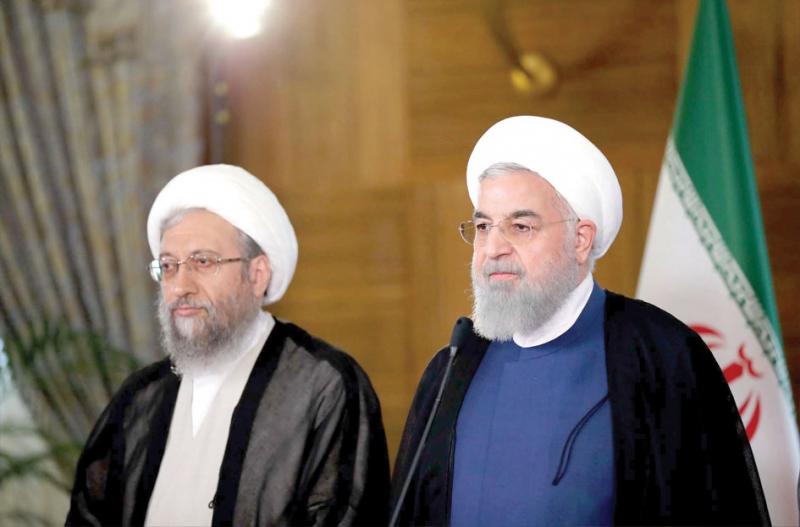 Iranian judiciary chief Sadegh Larijani (L) and Iranian President Hassan Rohani during a meeting in Tehran