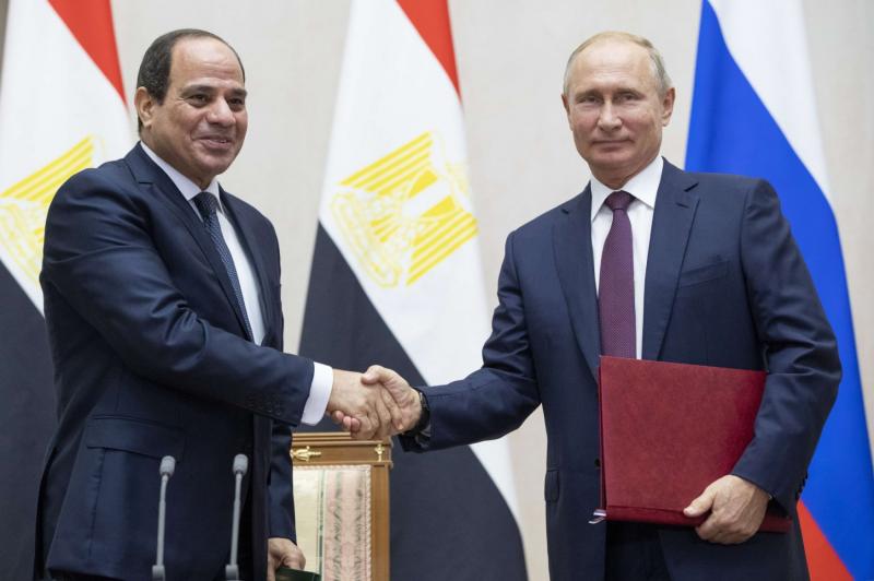 Russian President Vladimir Putin, right, and Egyptian President Abdel-Fattah el-Sisi shake hands after a signing ceremony following their talks in Sochi, Russia, Wednesday, October 17, 2018
