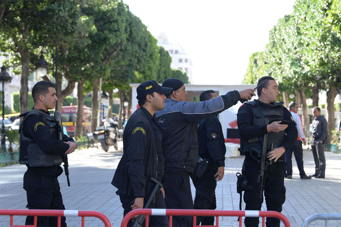 Tunisian police gathering at the site of a suicide attack in the centre of the Tunisian capital Tunis