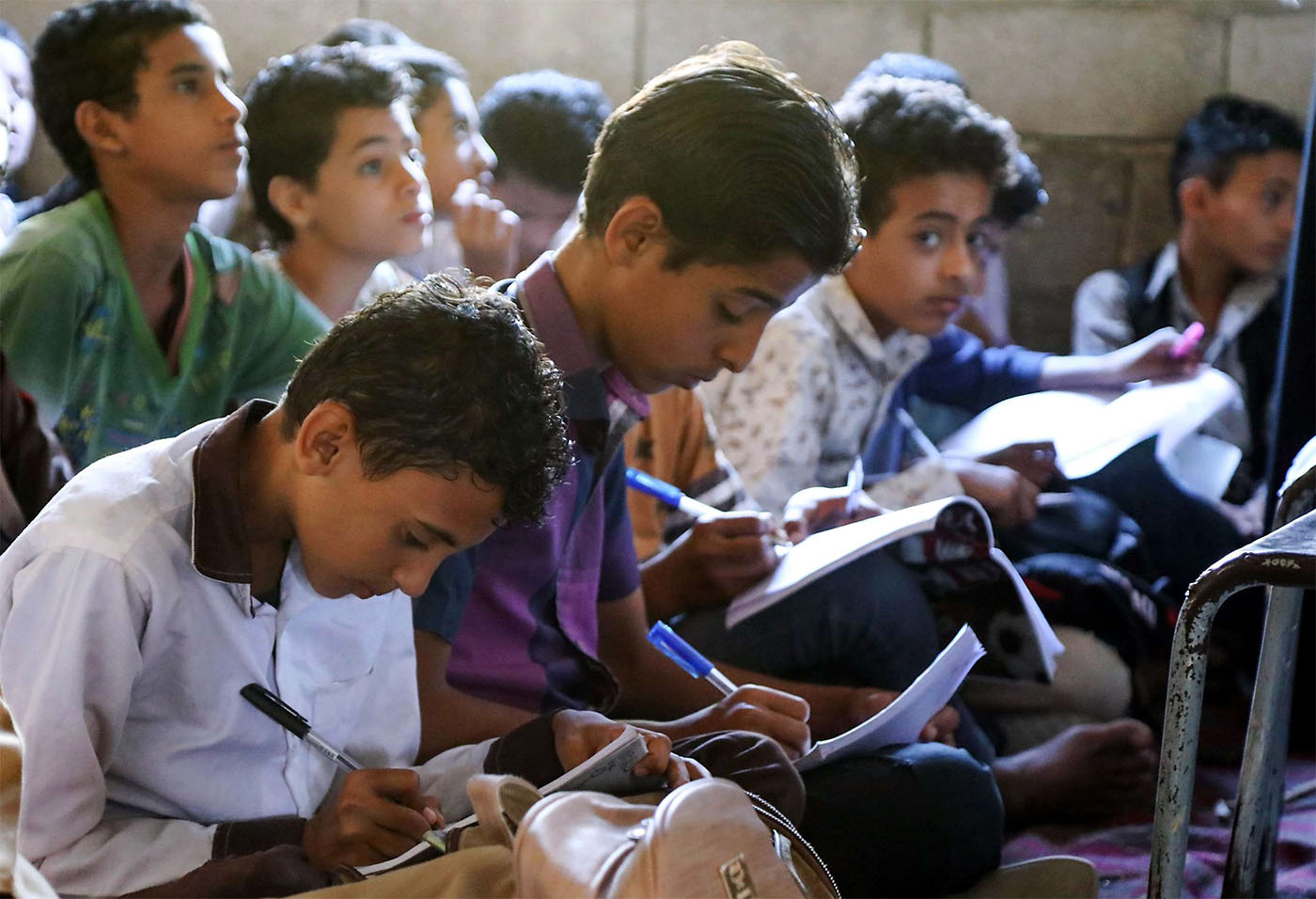 Schoolchildren attending their class in the ramshackle 