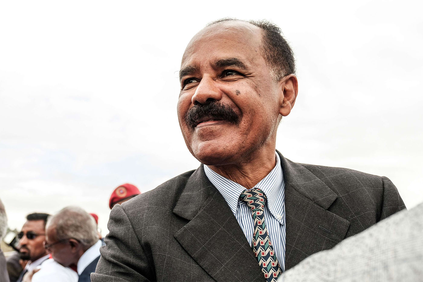 Eritrea's President Isaias Afwerki smiles upon his arrival at the airport in Gondar