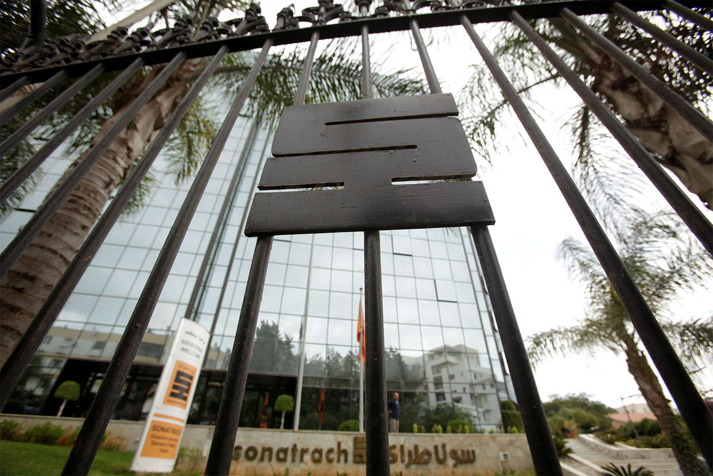 The logo of the state energy company Sonatrach is pictured on a gate outside the headquarters in Algiers