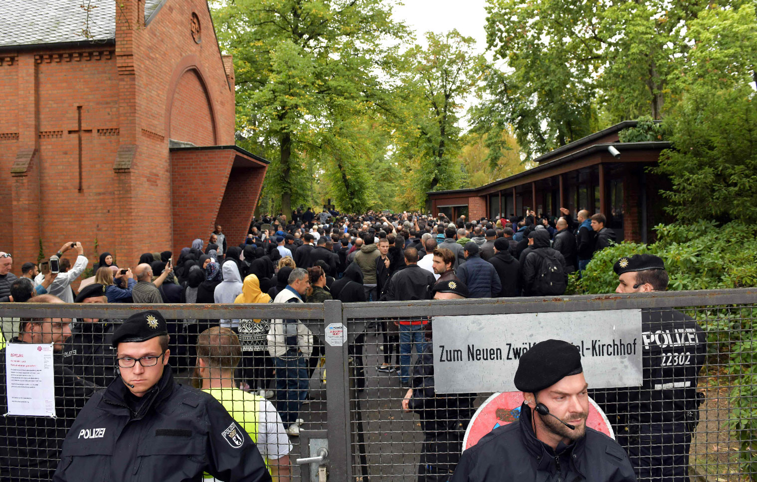Police secure the area outside the New Twelve Apostle Churchyard where the funeral of shot multiple offender Nidal Rabih takes place in Berlin, on September 13, 2018.