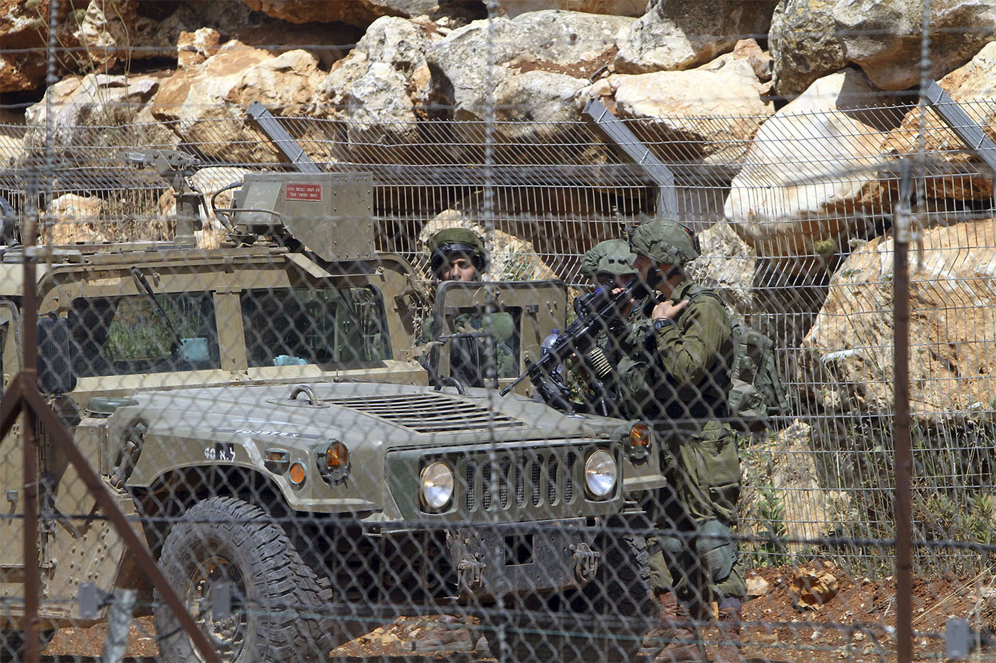 Israeli soldiers patrol the Lebanon-Israel border