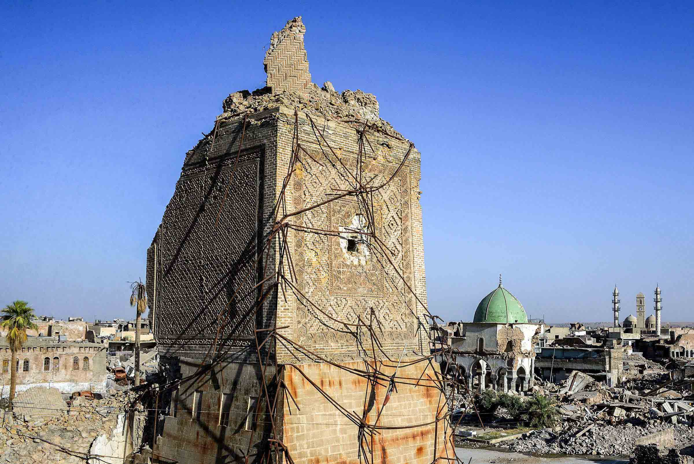All that is left of the minaret is part of its rectangular base, the rest of it sheared off by fighting