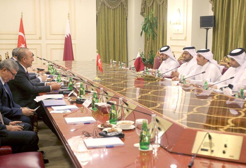 Qatari Foreign Minister Mohammed bin Abdulrahman bin Jassim al-Thani meets with Turkish Foreign Minister Mevlut Cavusoglu in Doha, last November