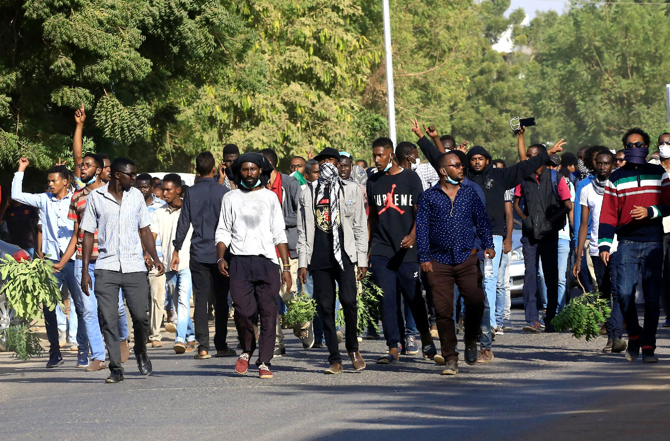 Sudanese demonstrators chant slogans as they march along the street during anti-government protests in Khartoum, Sudan December 25, 2018.