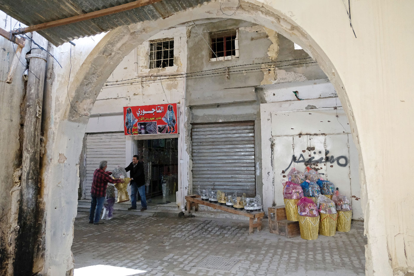 A shopkeeper sells traditional goods at the old popular market known as the Souk al-Jureid, which was destroyed during the war, in Benghazi, Libya February 7, 2019.