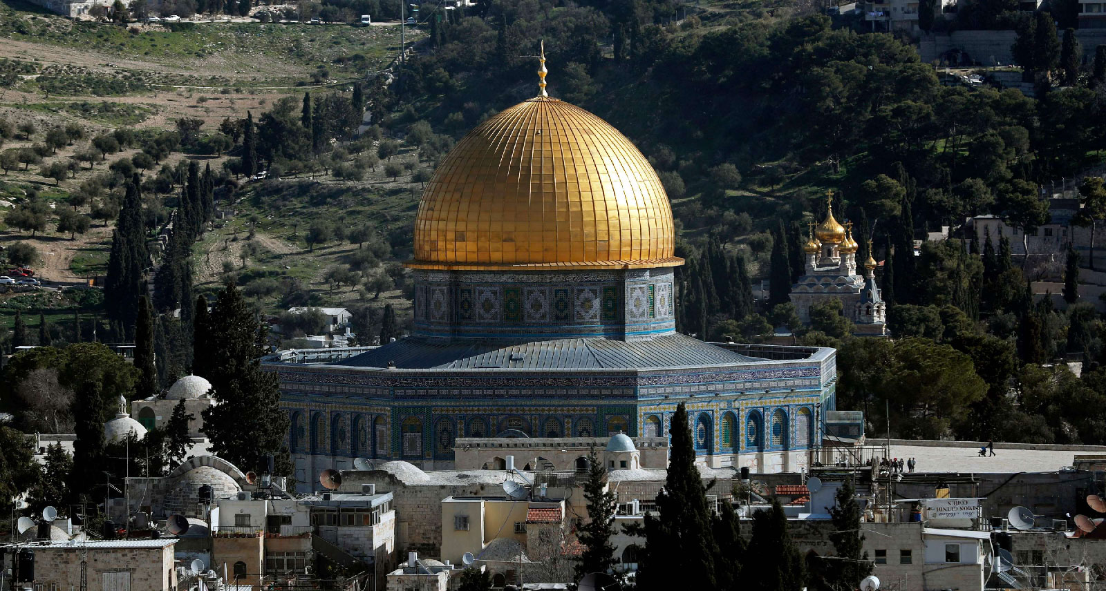 The Dome of the Rock, situated in the al-Aqsa mosque compound in Jerusalem's Israeli-occupied old city, and the Russian Church of Mary Magdalene (R) are pictured on January 23, 2019.