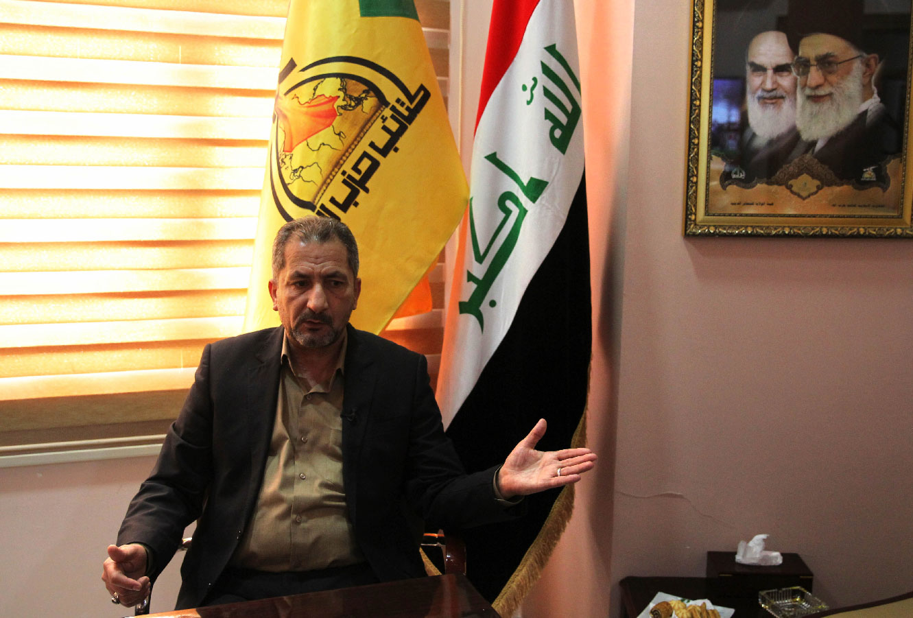 Iraq's spokesman for the Hezbollah Brigades Mohammed Mohie gestures during a news conference in Baghdad on February 5, 2019.