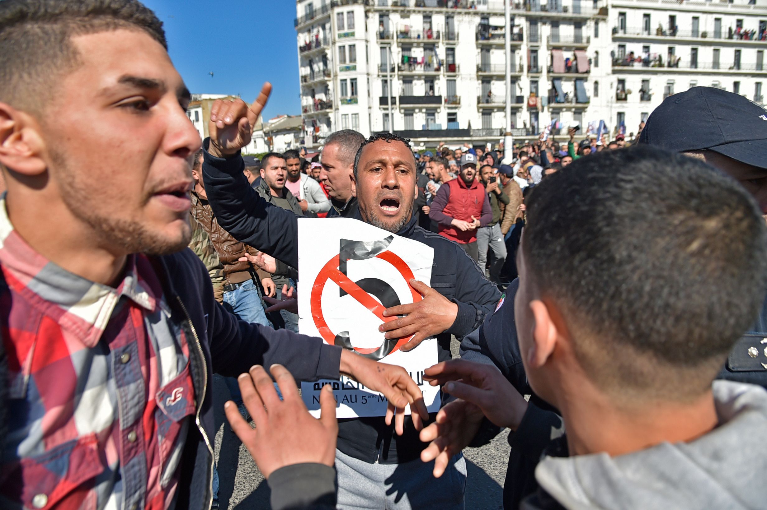 Algerian protestors demonstrate against their president's candidacy for a fifth term, on February 22, 2019 in Algiers.