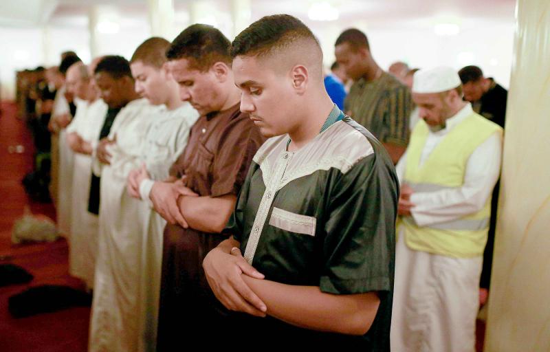 People pray at the Grand Mosque of Saint-Denis near Paris