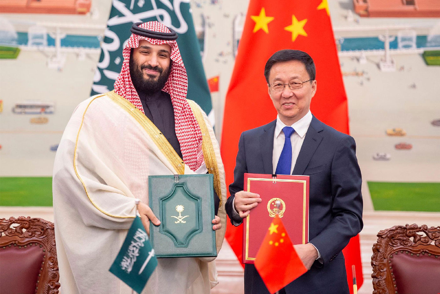 Saudi Crown Prince Mohammed bin Salman bin Abdulaziz Al Saud (L) and Han Zheng, Vice-Premier of the State Council of the People's Republic of China, pose for pictures during after the signing of memorandums of understanding at the Great Hall of the People in Beijing, China on 22 February 2019 . 