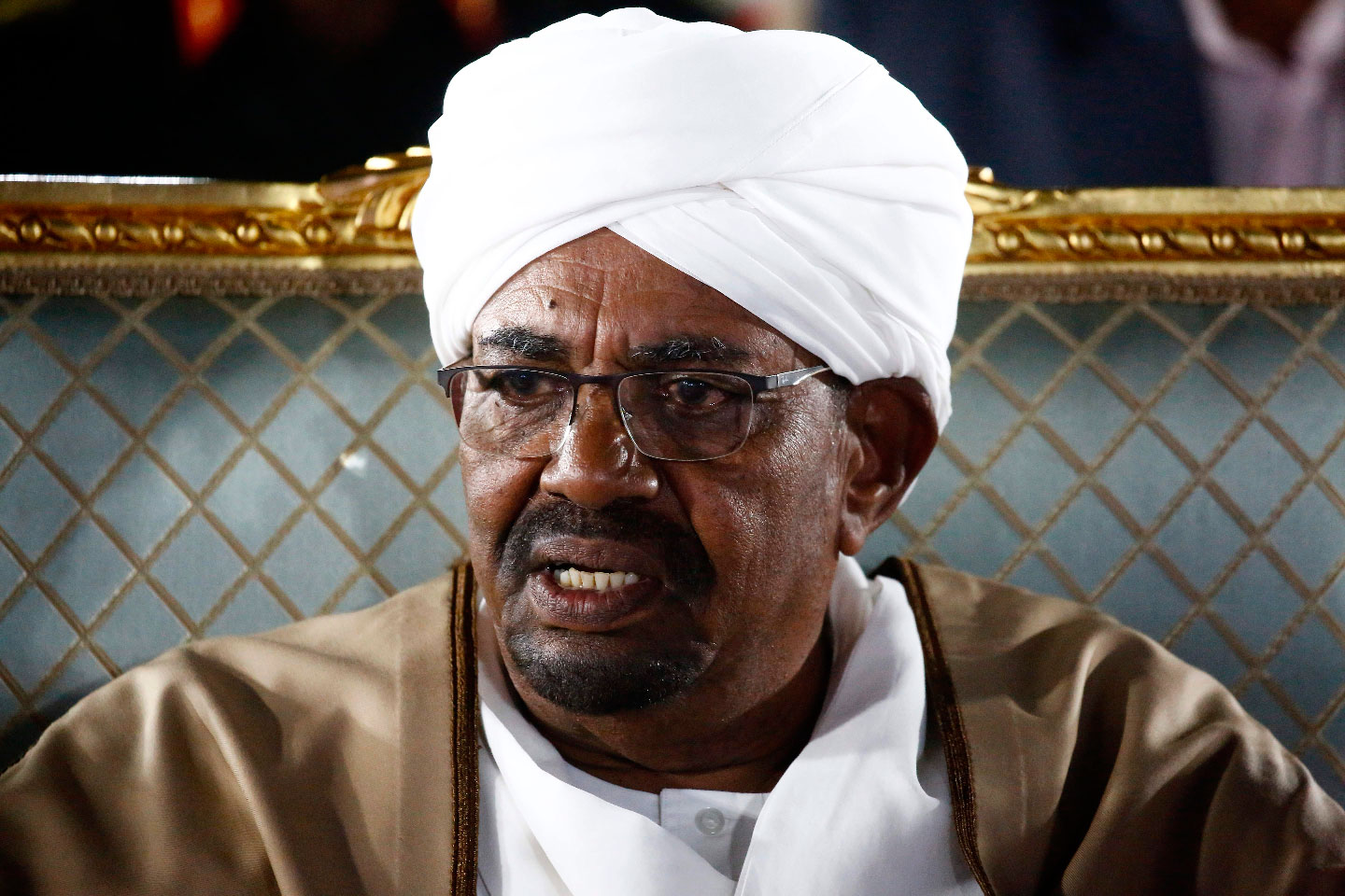 Sudanese President Omar al-Bashir sits before delivering a speech to the nation on February 22, 2019, at the presidential palace in the capital Khartoum.