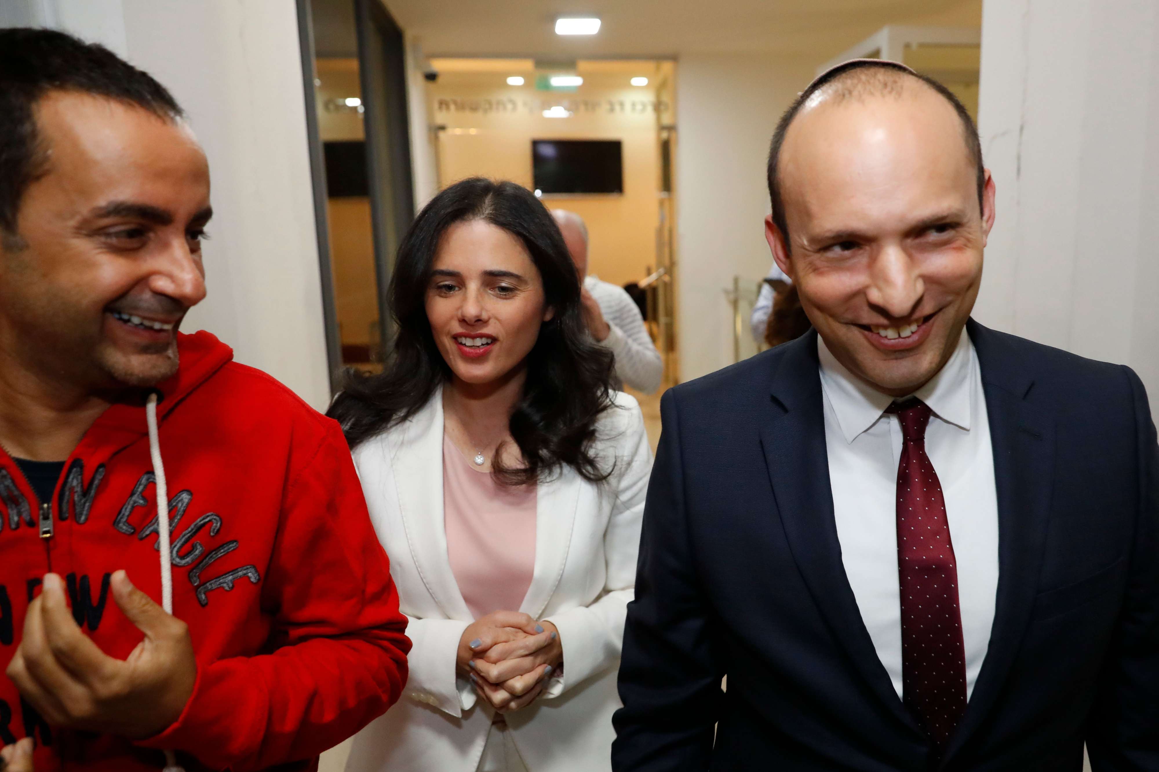 Israel's Minister of Education Naftali Bennett (R) and Israeli Justice Minister Ayelet Shaked (C) walk during a press conference to announce the formation of new political party HaYemin HeHadash or The New Right on December 29, 2018 in the coastal city of Tel Aviv.