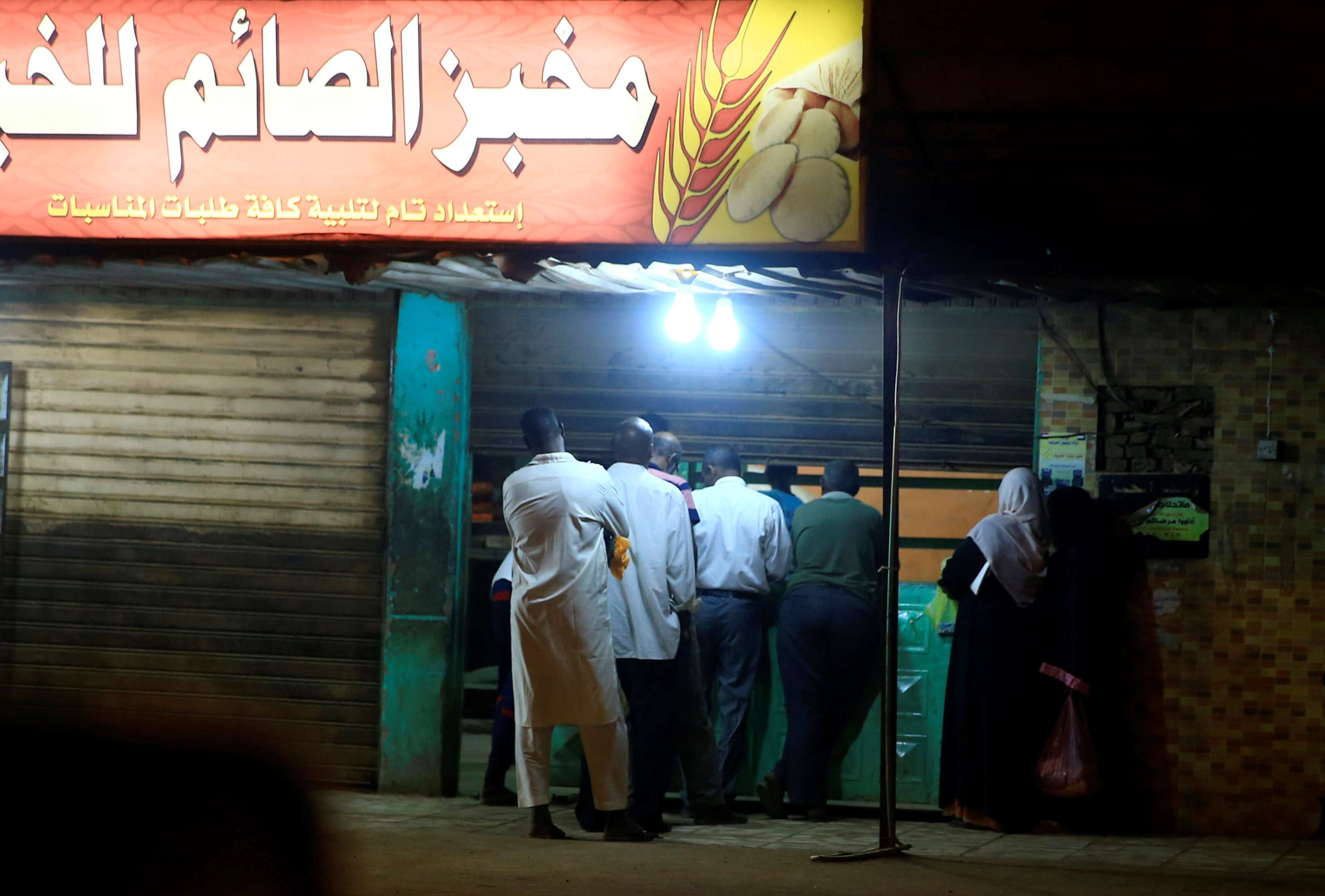 Civilians queue to buy bread from a bakery in Khartoum, Sudan January 6, 2019.
