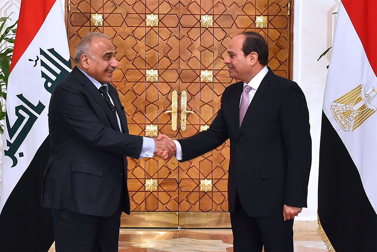 Egyptian leader Abdel Fattah al-Sisi (R) shaking hands with Iraqi PMAdel Abdel Mahdi 