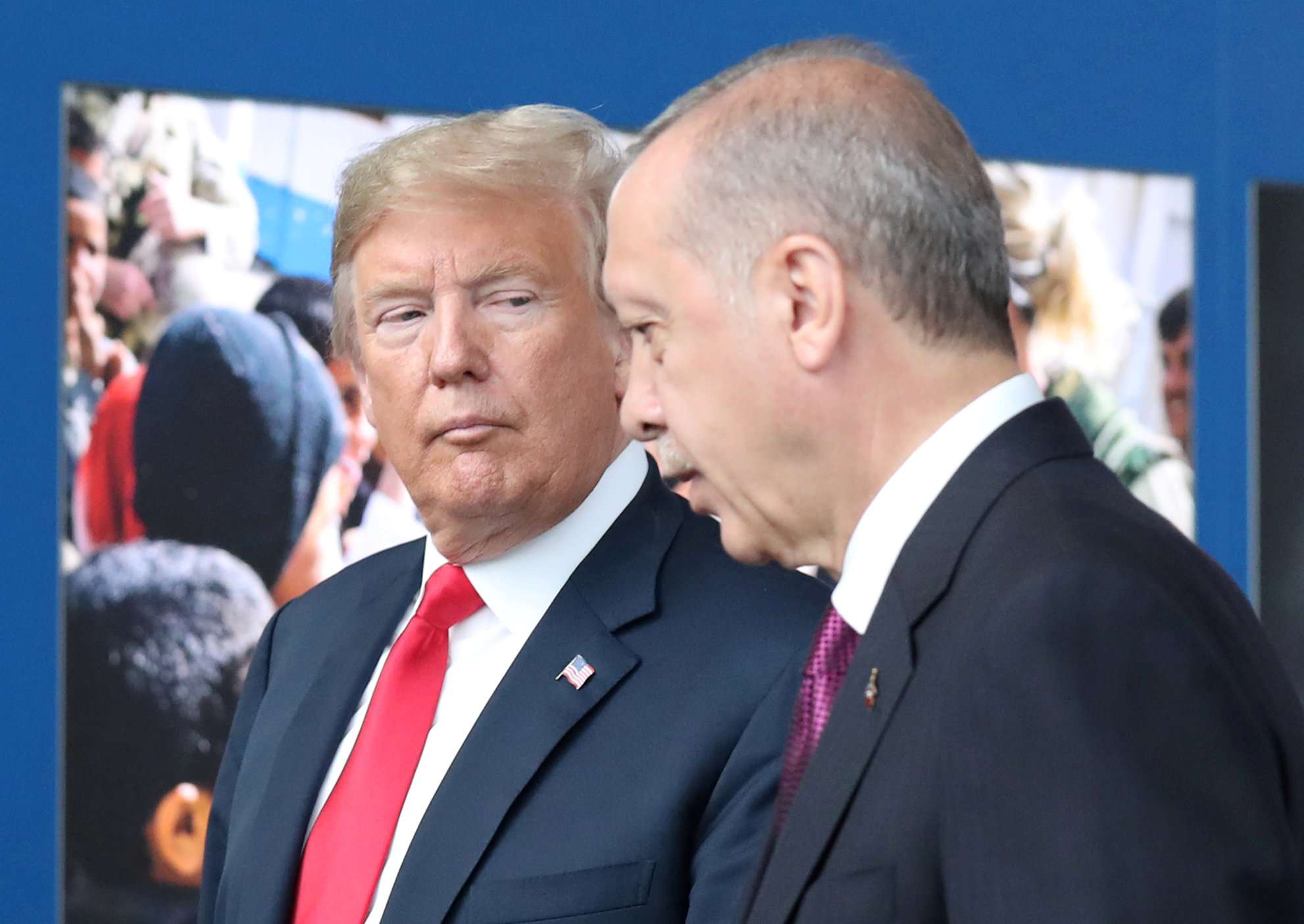 US President Donald Trump (L) talks to Turkey’s President Recep Tayyip Erdogan (R) at NATO headquarters in Brussels, Belgium, 11 July 2018.