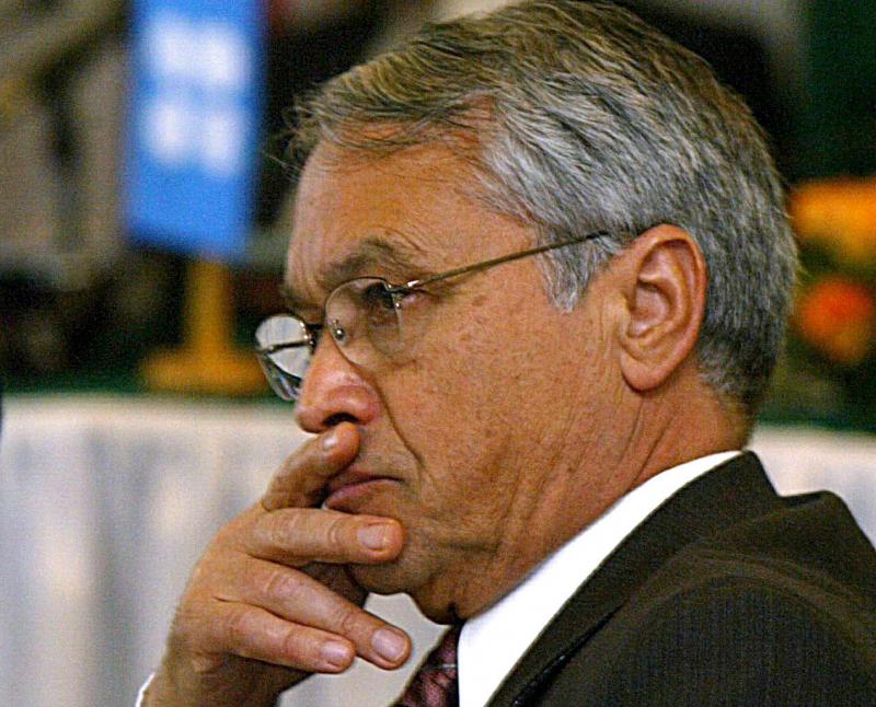 Then Algerian Energy Minister Chakib Khelil listens to the opening speech at the Organisation of Petroleum Exporting Countries (OPEC) meeting in Algiers, in this February 10, 2004 file photo