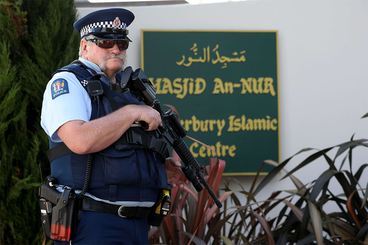 An armed police officer stands guard outside the Al Noor mosque in Christchurch 