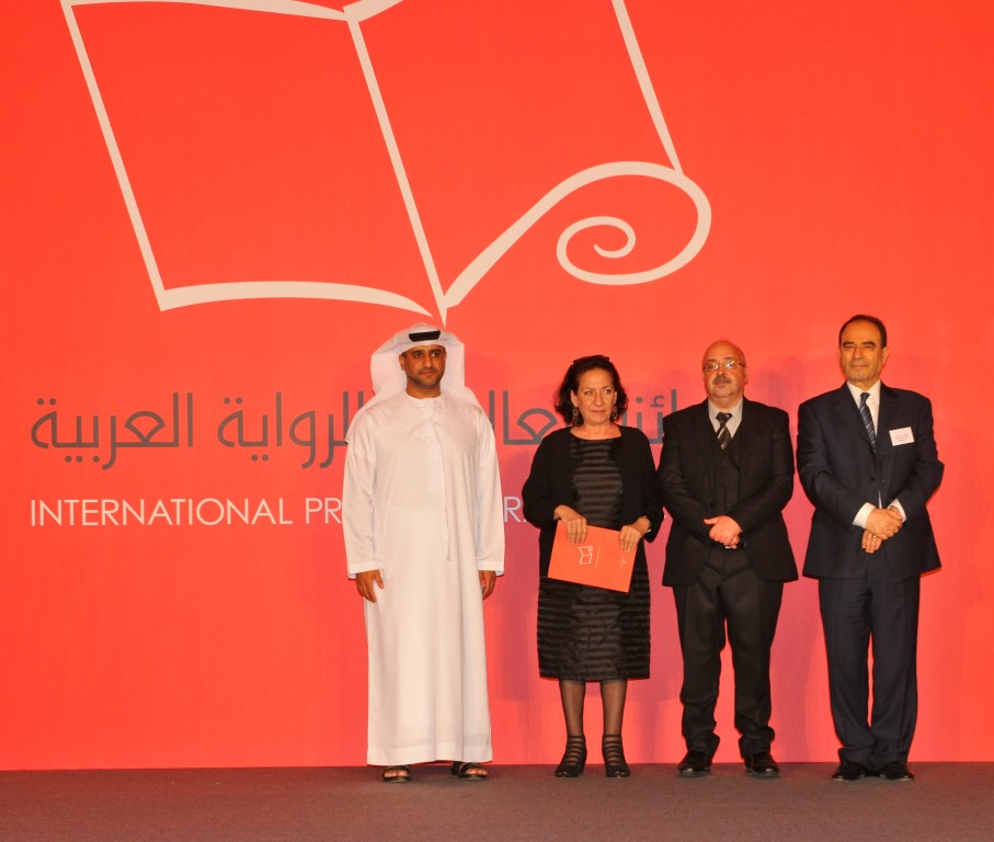 Hoda Barakat (2nd L) accepts the International Prize for Arab Fiction