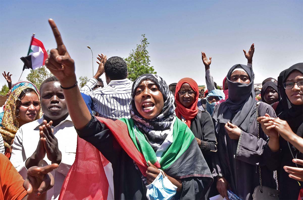 Sudanese demonstrators gather near the military headquarters in Khartoum