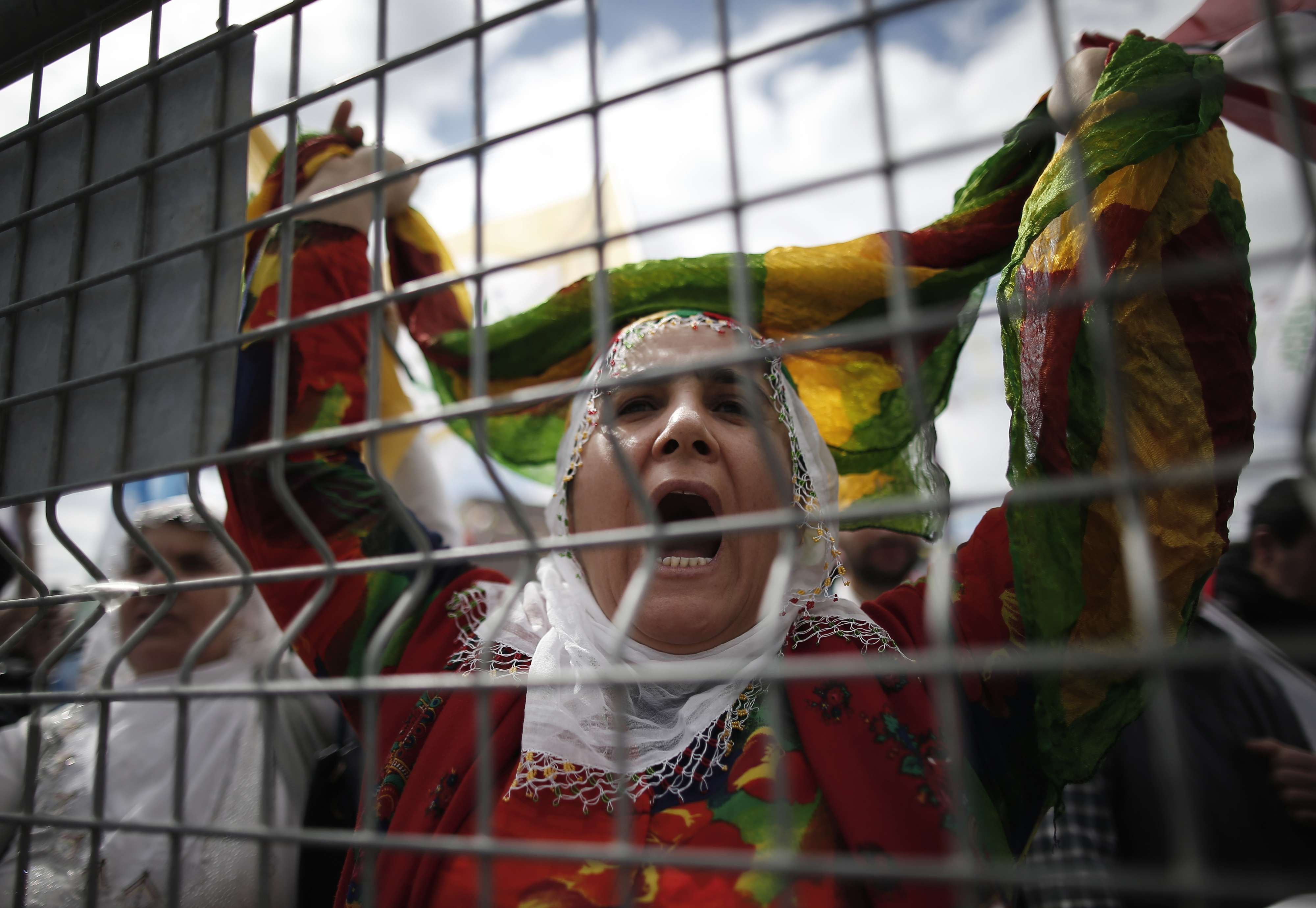 In this photo taken on Sunday, March 24, 2019, a woman shouts as thousands of supporters of pro-Kurdish Peoples' Democratic Party, or HDP, gather to celebrate the Kurdish New Year and to attend a campaign rally in Istanbul, ahead of local elections scheduled for March 31, 2019.