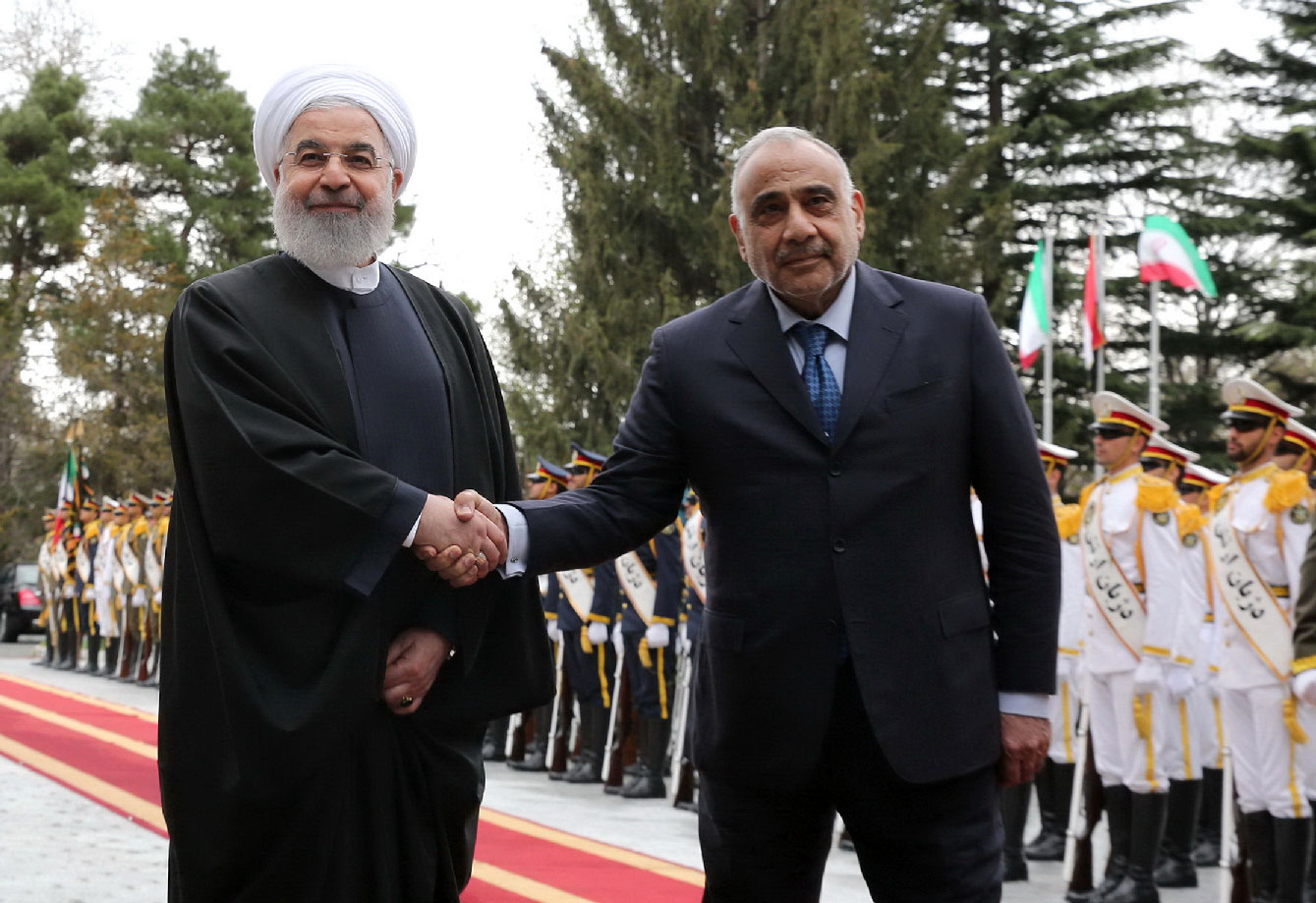 A handout picture provided by the Iranian presidency on April 6, 2019 shows Iranian President Hassan Rouhani (L) welcoming the Iraqi Prime Minister Adel Abdel Mahdi (R) in the Iranian capital Tehran.