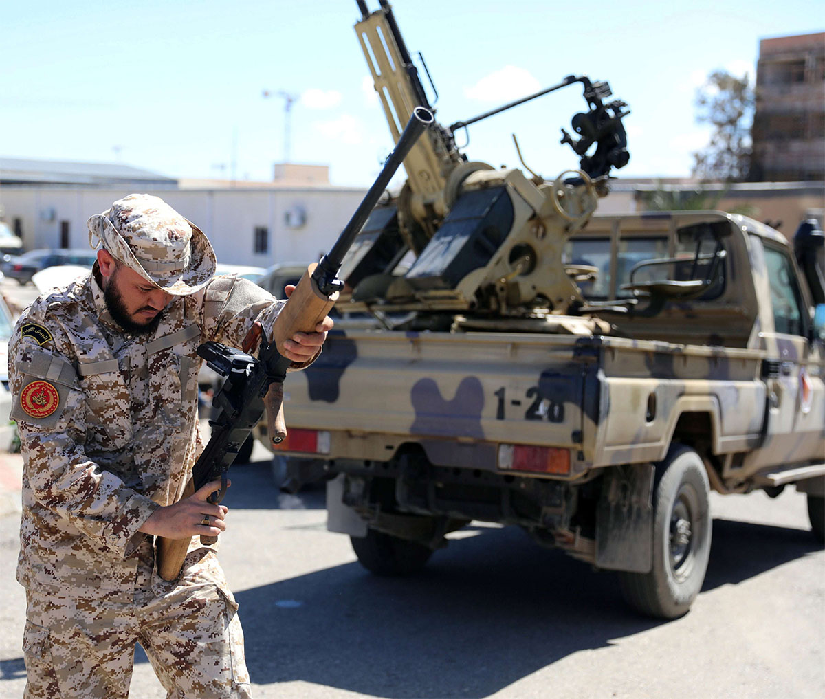 A Member of Misrata forces prepares himself to go to the front line in Tripoli