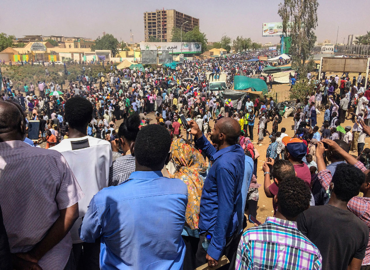 Protesters rally at a demonstration near the military headquarters, Tuesday, April 9, 2019, in the capital Khartoum, Sudan.