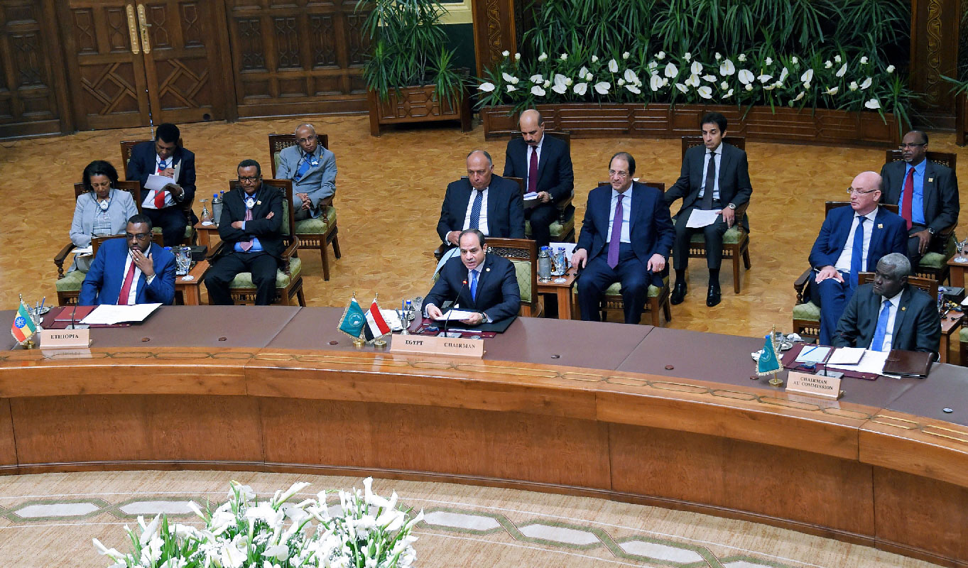 Egyptian President Abdel Fattah al-Sisi (C) speaking during a summit with African leaders in the capital Cairo