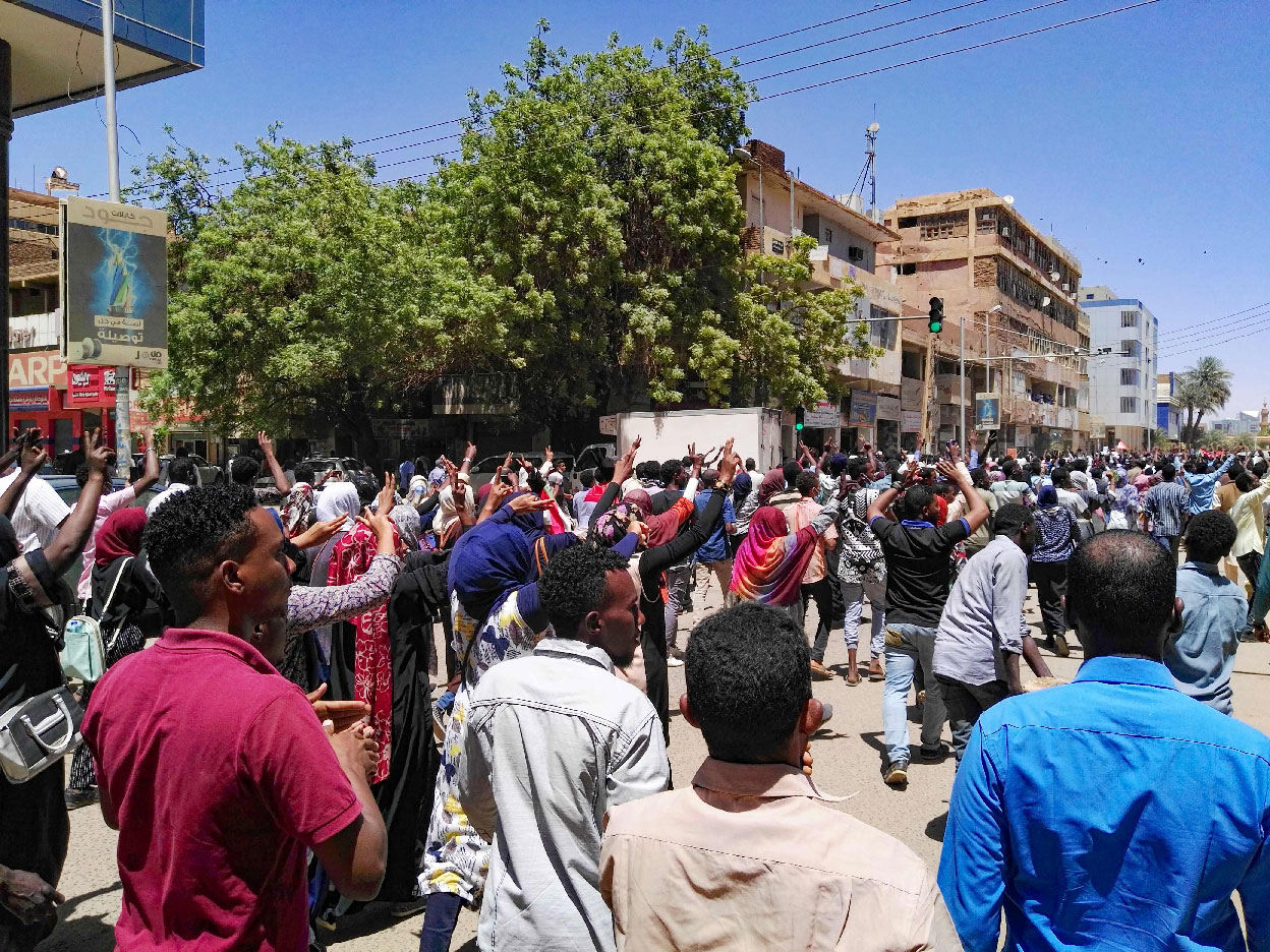 Sudanese protesters chant slogans during an anti-government demonstration in the capital Khartoum on April 6, 2019.