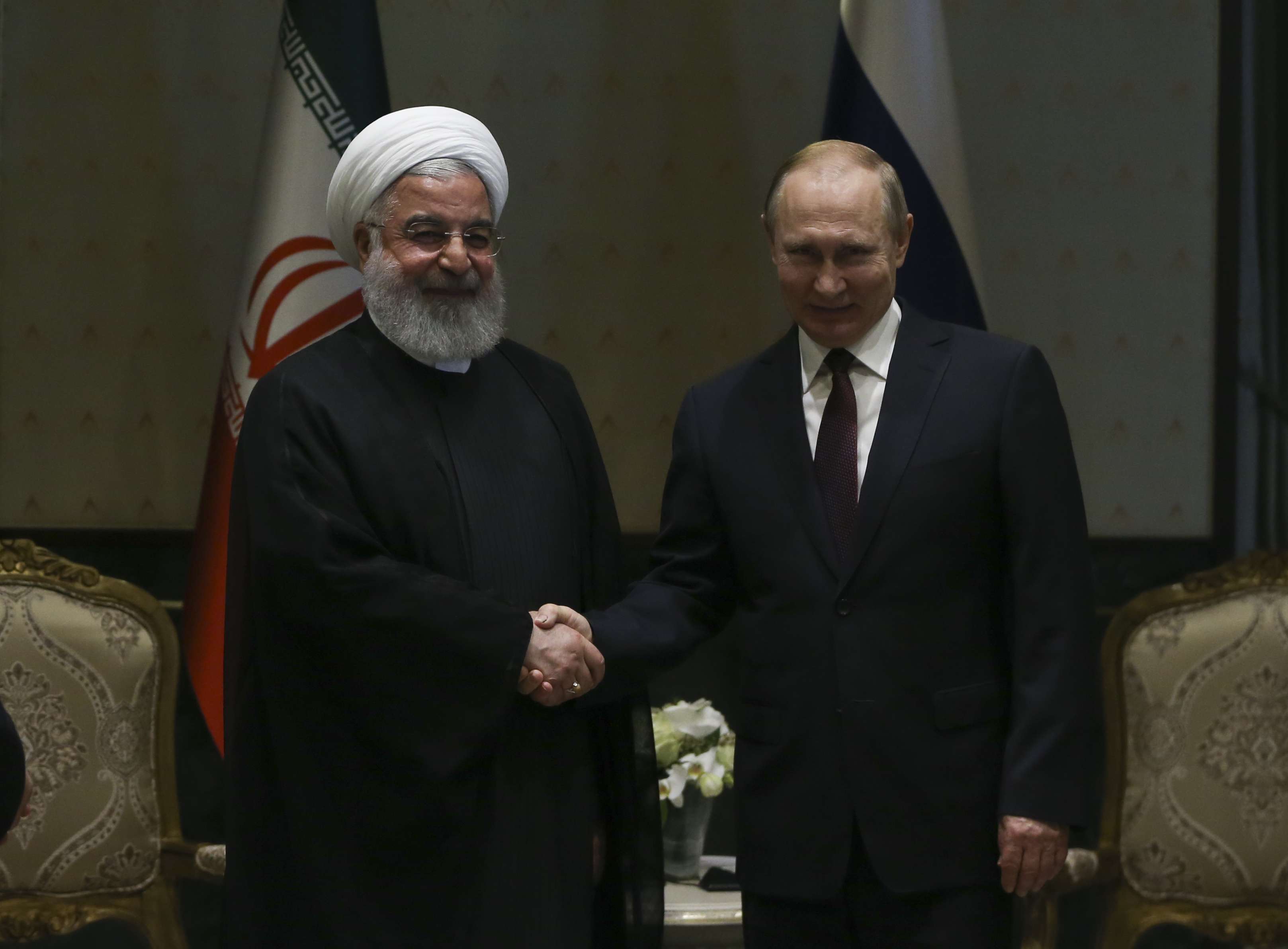 الرئيس الايراني حسن روحاني يلتقي الرئيس الروسي فلاديمير بوتين