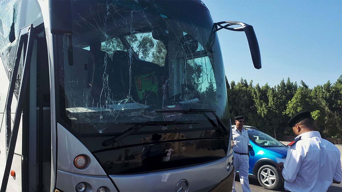 Tourist bus damaged during a bomb blast near Giza pyramids.