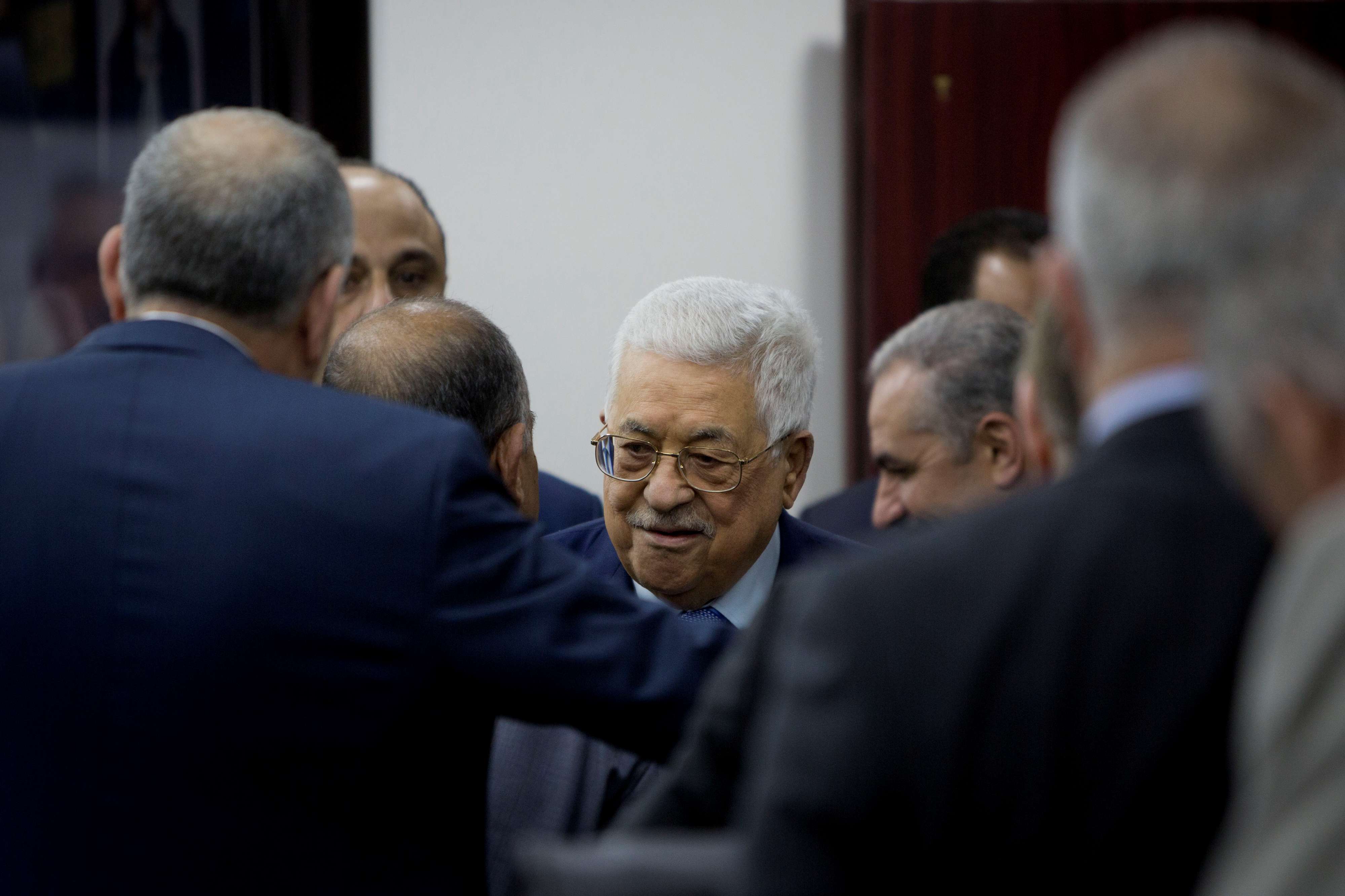 Palestinian President Mahmoud Abbas arrives for a session of the weekly cabinet meeting in Ramallah