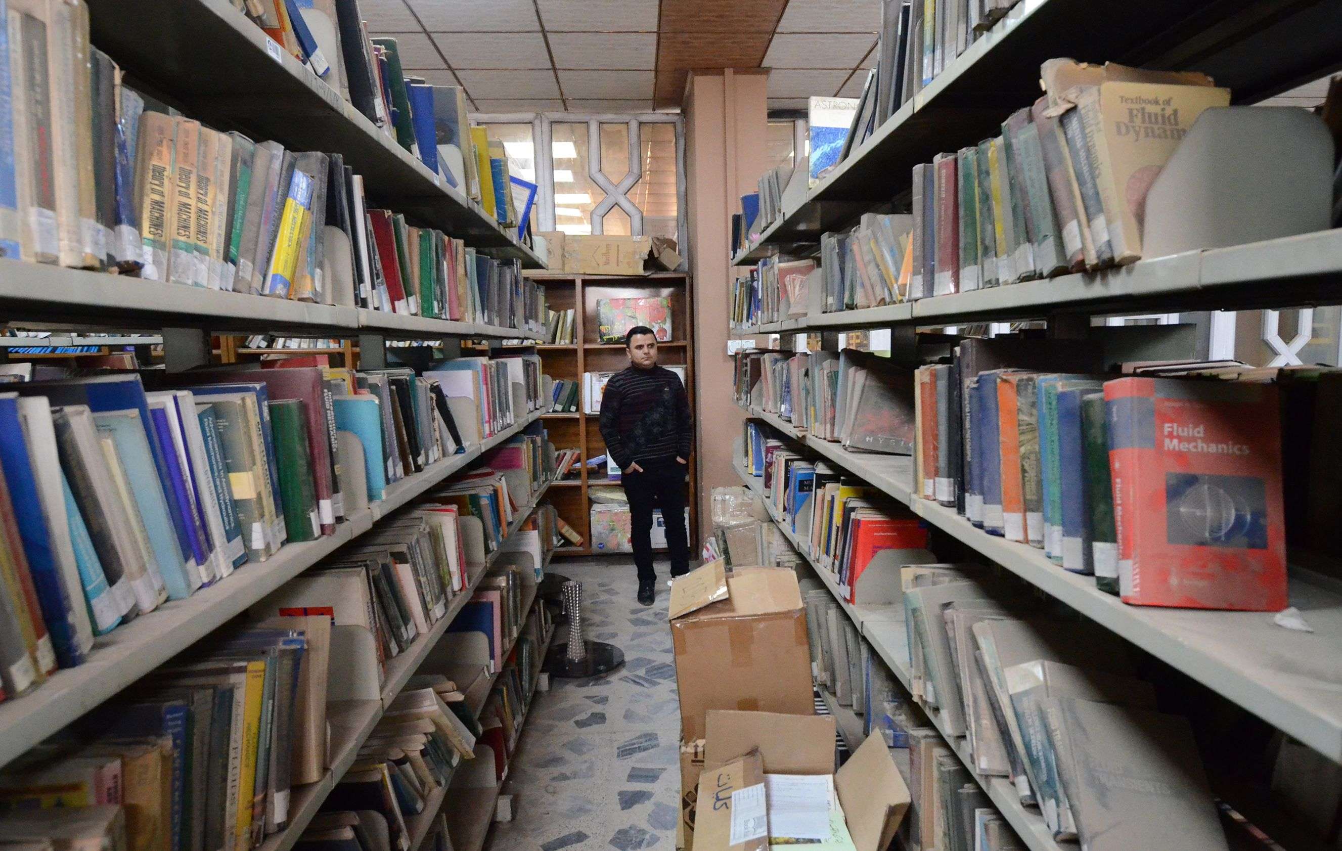 Although Mosul has been back in government hands since 2017, its young academics see the barren bookshelves as part of IS's dark legacy