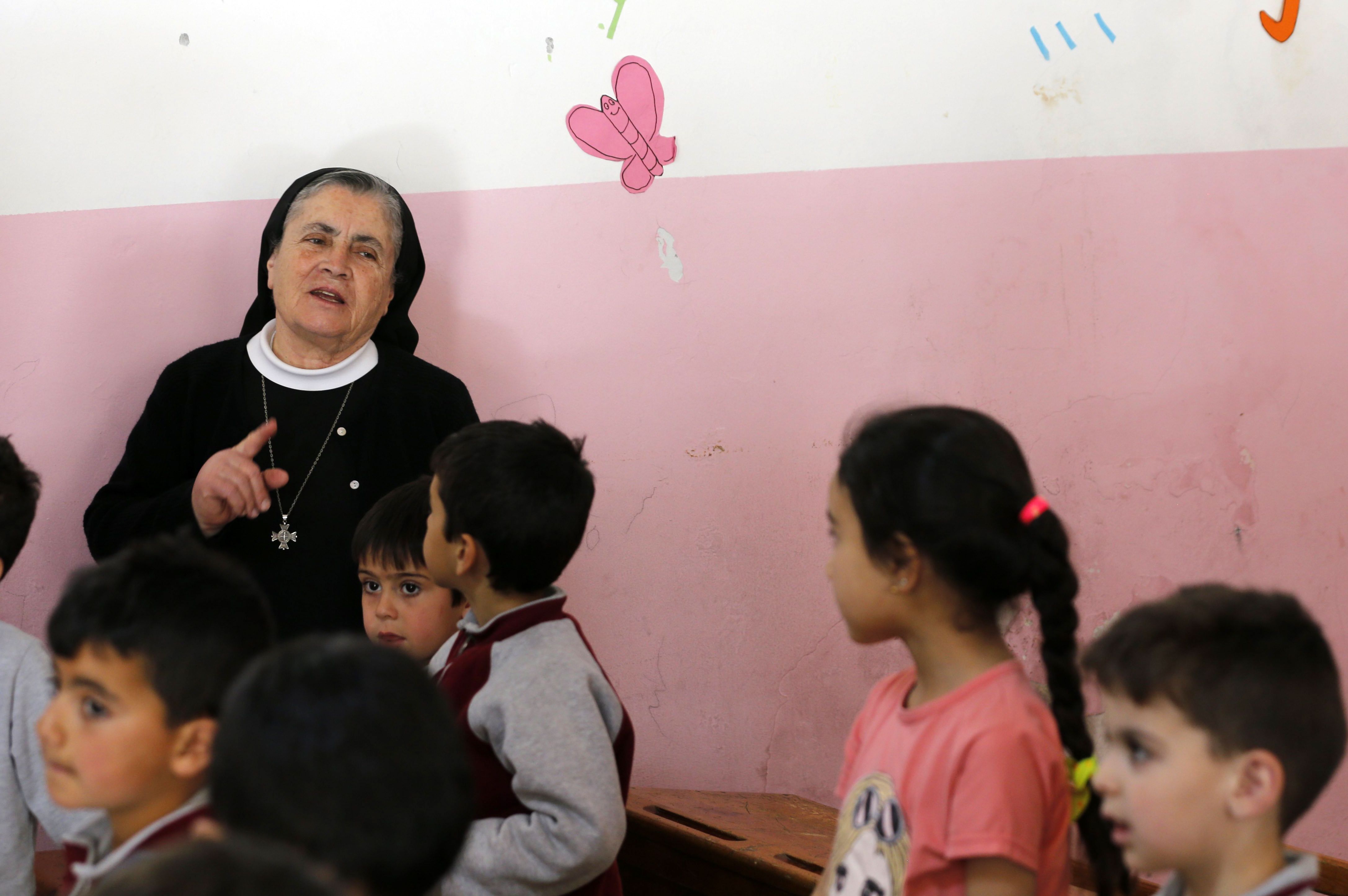 Angel Allam, a nun and teacher, instructs her students in the Aramaic language