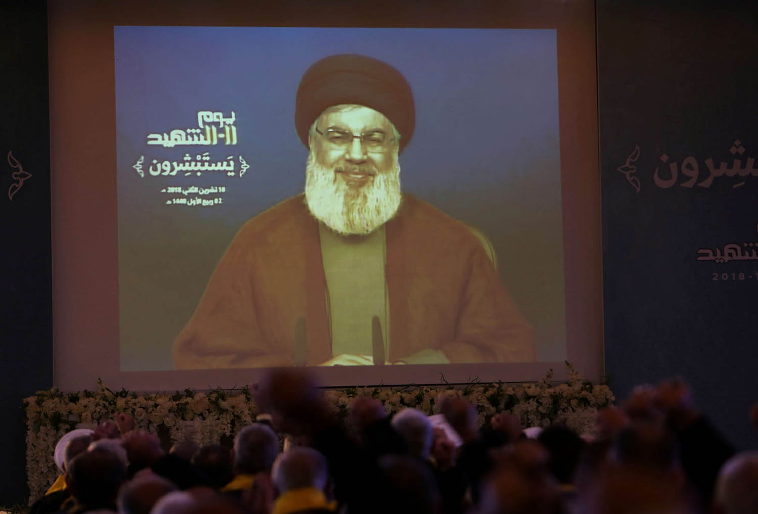 زعيم حزب الله حسن نصر الله يتحدث من خلال تسجيل مصور إلى مؤيديه