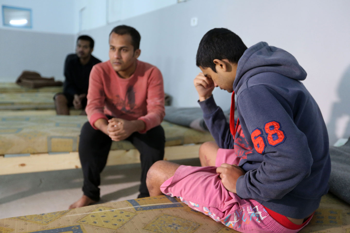 Survivors of the shipwreck at a shelter in the Tunisian coastal city of Zarzis 