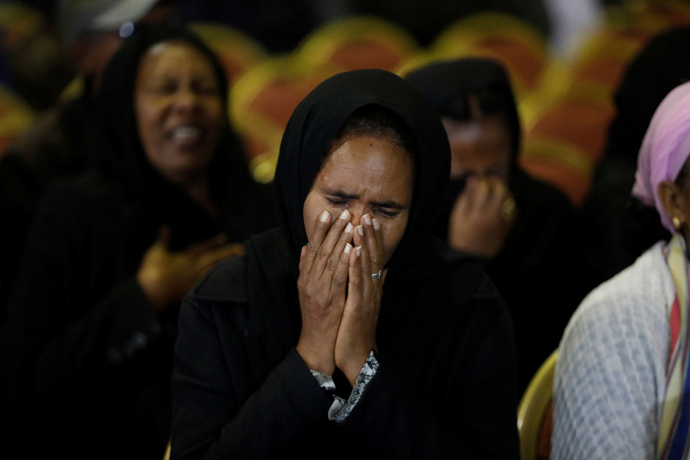 A mourner reacts during a memorial ceremony for the Ethiopian Army Chief of Staff Seare Mekonnen