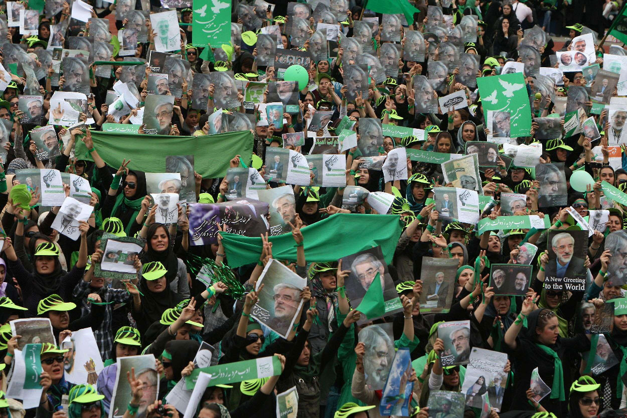 Supporters of Iranian presidential candidate Mir Hossein Mousavi wave green flags on June 9, 2009
