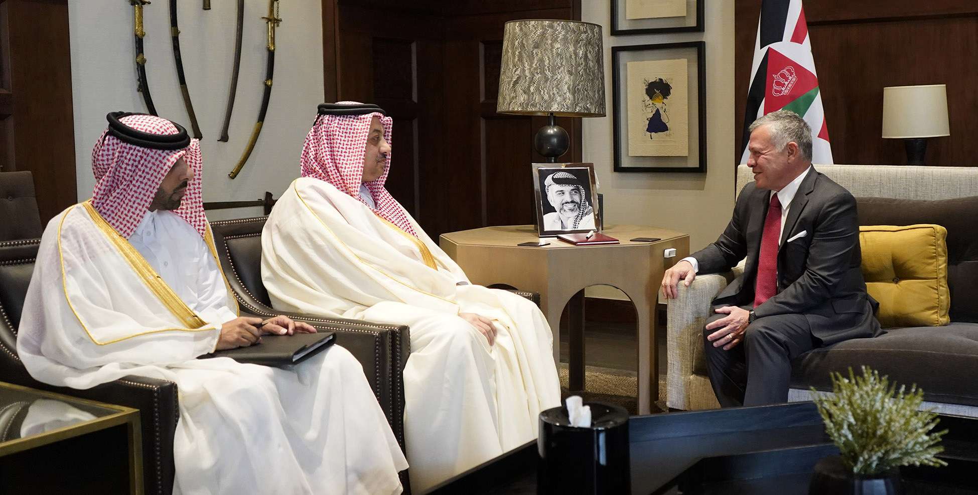 Jordanian King Abdullah II (R) receiving Qatar's Deputy Prime Minister of Qatar and Minister of State for Defence Affairs Khalid bin Mohammed Al-Attiyah (C) in the capital Amman