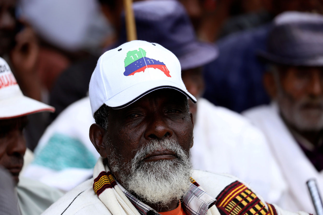 A Sidama elder wears a cap with an imprinted Sidama region flag
